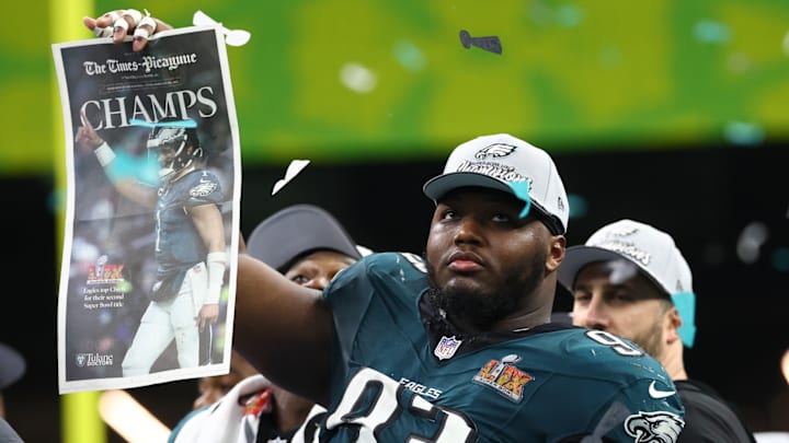 Feb 9, 2025; New Orleans, LA, USA; Philadelphia Eagles defensive tackle Milton Williams (93) celebrates on the podium after defeating the Kansas City Chiefs in Super Bowl LIX at Ceasars Superdome. 