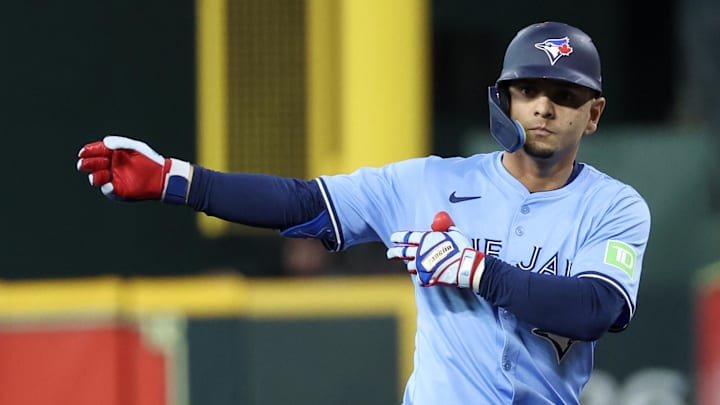 Apr 23, 2025; Houston, Texas, USA; Toronto Blue Jays second baseman Andres Gimenez (0) reacts to his single against the Houston Astros in the second inning at Daikin Park.