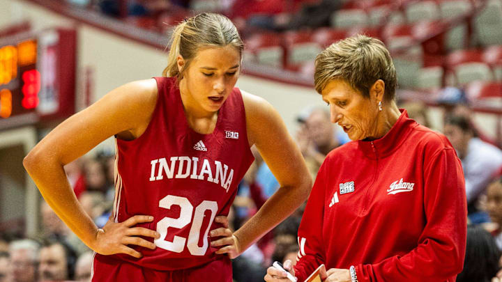 Indiana Head Coach Teri Moren talks with Julianna LaMendola (20) during the Indiana versus Maine women's basketball game at Simon Skjodt Assembly Hall on Sunday, Dec. 1, 2024.