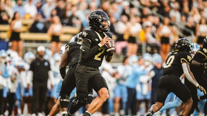 Nov 15, 2025; Winston-Salem, North Carolina, USA; Wake Forest Demon Deacons quarterback Robby Ashford (2) looks to pass the ball against the North Carolina Tar Heels at Allegacy Federal Credit Union Stadium. Mandatory Credit: Wake Forest Athletics via Imagn Images Nov 15, 2025; Winston-Salem, North Carolina, USA; Wake Forest Demon Deacons quarterback Robby Ashford (2) looks to pass the ball against the North Carolina Tar Heels at Allegacy Federal Credit Union Stadium. Mandatory Credit: Wake Forest Athletics via Imagn Images