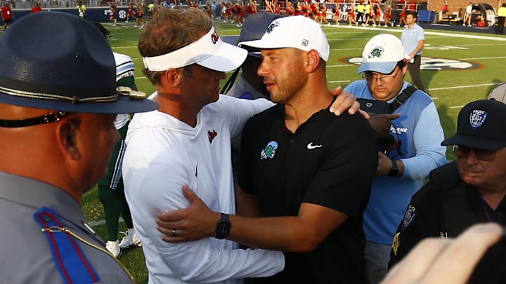 Sep 20, 2025; Oxford, Mississippi, USA; Mississippi Rebels head coach Lane Kiffin (left) and Tulane Green Wave head coach Jon Sumrall (right) embrace after the game at Vaught-Hemingway Stadium. Mandatory Credit: Petre Thomas-Imagn Images