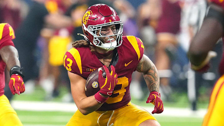 Sep 1, 2024; Paradise, Nevada, USA; Southern California Trojans linebacker Mason Cobb (13) gets up to run after making an interception against the LSU Tigers in the final seconds of the fourth quarter at Allegiant Stadium. Mandatory Credit: Stephen R. Sylvanie-Imagn Images