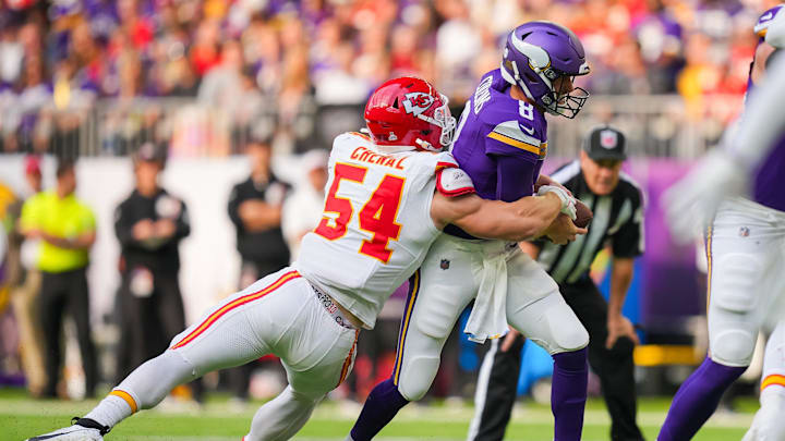 Oct 8, 2023; Minneapolis, Minnesota, USA; Kansas City Chiefs linebacker Leo Chenal (54) sacks Minnesota Vikings quarterback Kirk Cousins (8) in the first quarter at U.S. Bank Stadium. Mandatory Credit: Brad Rempel-USA TODAY Sports