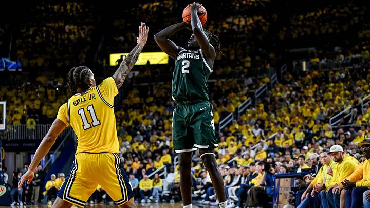 Michigan State's Kur Teng, right, makes a 3-pointer against Michigan's Roddy Gayle Jr. during the first half on Sunday, March 8, 2026, at the Crisler Center in Ann Arbor. Michigan State's Kur Teng, right, makes a 3-pointer against Michigan's Roddy Gayle Jr. during the first half on Sunday, March 8, 2026, at the Crisler Center in Ann Arbor.