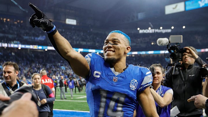 Detroit Lions wide receiver Amon-Ra St. Brown celebrates the 31-23 win over the Tampa Bay Buccaneers in the NFC divisional round at Ford Field in Detroit on Sunday, Jan. 21, 2024. His hair is dyed blue. Detroit Lions wide receiver Amon-Ra St. Brown celebrates the 31-23 win over the Tampa Bay Buccaneers in the NFC divisional round at Ford Field in Detroit on Sunday, Jan. 21, 2024. His hair is dyed blue.