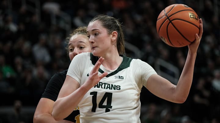 Michigan State junior Grace VanSlooten (14) looks to pass against Michigan at the Breslin Center Sunday, Feb. 9, 2025. Michigan State junior Grace VanSlooten (14) looks to pass against Michigan at the Breslin Center Sunday, Feb. 9, 2025.