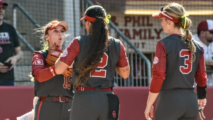 Oklahoma outfielder Abby Dayton, left, with Nelly McEnroe-Marinas and Chaney Helton. With McEnroe-Marinas out for the season, Dayton, normally an outfielder, has worked at third base. Oklahoma outfielder Abby Dayton, left, with Nelly McEnroe-Marinas and Chaney Helton. With McEnroe-Marinas out for the season, Dayton, normally an outfielder, has worked at third base.