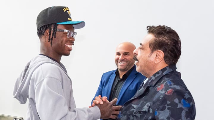 The Jacksonville Jaguars first-round pick, Colorado Buffaloes wide receiver and defensive back Travis Hunter, left, was greeted by Jaguars owner Shahid Khan after Hunter arrived on Friday, March 25, 2025 at Miller Electric Center in Jacksonville, Fla. 