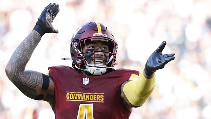 Nov 24, 2024; Landover, Maryland, USA; Washington Commanders linebacker Frankie Luvu (4) celebrates after making a play Dallas Cowboys during the second quarter at Northwest Stadium. Mandatory Credit: Geoff Burke-Imagn Images