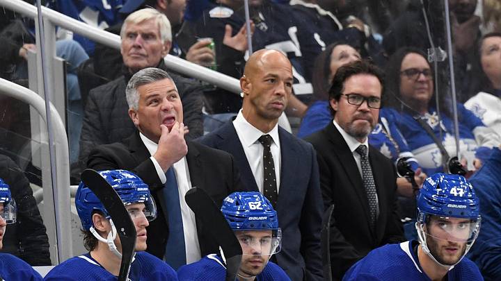 Oct 8, 2022; Toronto, Ontario, CAN; Toronto Maple Leafs head coach Sheldon Keefe (left) looks up at the scoreboard as assistant coaches Manny Malhotra (center) and Dean Chynoweth look on during a break in play against the Detroit Red Wings at Scotiabank Arena. Mandatory Credit: Dan Hamilton-Imagn Images Oct 8, 2022; Toronto, Ontario, CAN; Toronto Maple Leafs head coach Sheldon Keefe (left) looks up at the scoreboard as assistant coaches Manny Malhotra (center) and Dean Chynoweth look on during a break in play against the Detroit Red Wings at Scotiabank Arena. Mandatory Credit: Dan Hamilton-Imagn Images