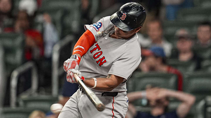 May 30, 2025; Cumberland, Georgia, USA; Boston Red Sox designated hitter Rafael Devers (11) drives in two runs with a single against the Atlanta Braves during the ninth inning at Truist Park.