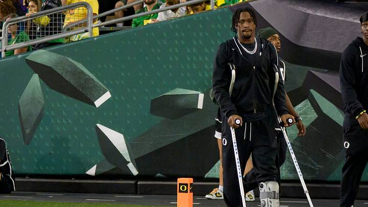 Oregon wide receiver Jeremiah McClellan walks on the field in a boot as the Oregon Ducks host the Portland State Vikings on Sept. 18, 2026, at Autzen Stadium in Eugene, Oregon.