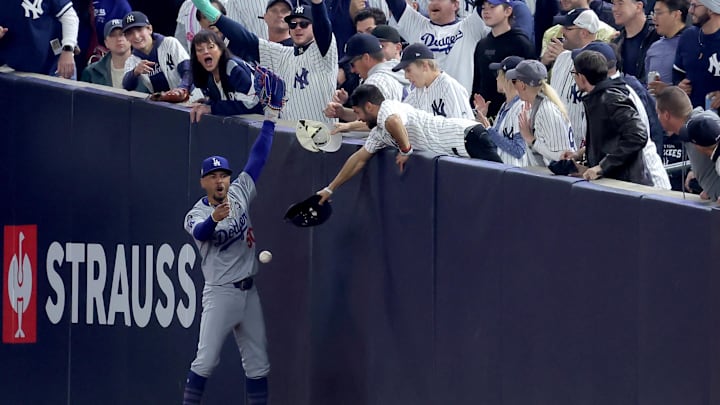 Despite over-the-top fan interference from two Yankees fans, Mookie Betts made the catch.