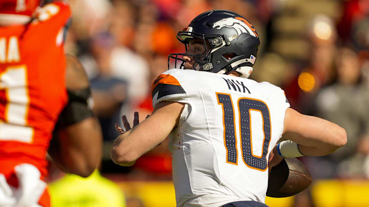 Nov 10, 2024; Kansas City, Missouri, USA; Denver Broncos quarterback Bo Nix (10) throws a pass during the first half against the Kansas City Chiefs at GEHA Field at Arrowhead Stadium.