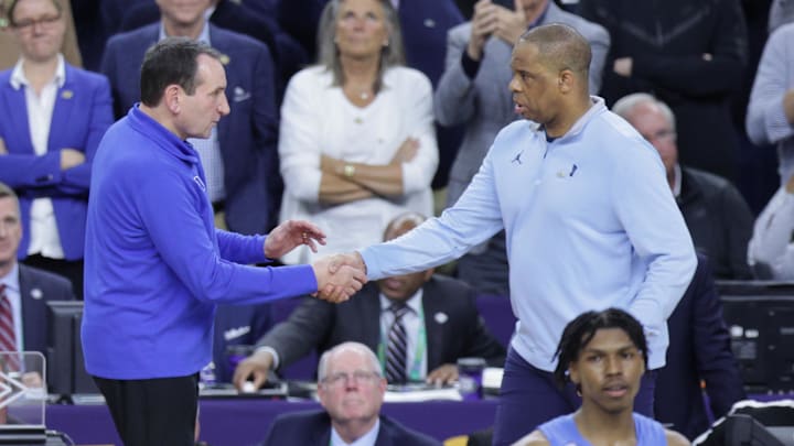 Apr 2, 2022; New Orleans, LA, USA; Duke Blue Devils head coach Mike Krzyzewski shakes hands with North Carolina Tar Heels head coach Hubert Davis after a Blue Devils loss during the 2022 NCAA men's basketball tournament Final Four semifinals at Caesars Superdome. Mandatory Credit: Stephen Lew-Imagn Images Apr 2, 2022; New Orleans, LA, USA; Duke Blue Devils head coach Mike Krzyzewski shakes hands with North Carolina Tar Heels head coach Hubert Davis after a Blue Devils loss during the 2022 NCAA men's basketball tournament Final Four semifinals at Caesars Superdome. Mandatory Credit: Stephen Lew-Imagn Images