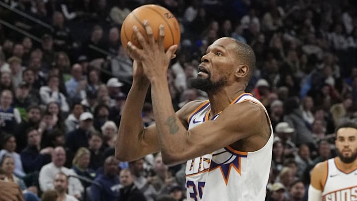 Mar 28, 2025; Minneapolis, Minnesota, USA; Phoenix Suns forward Kevin Durant (35) shoots against the Minnesota Timberwolves in the third quarter at Target Center. Mandatory Credit: Bruce Kluckhohn-Imagn Images