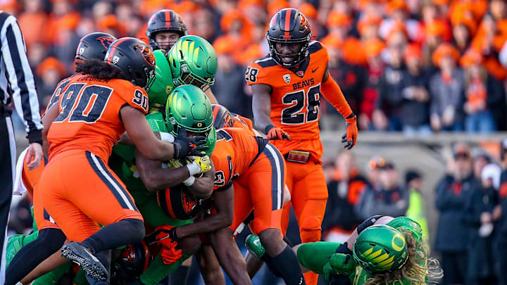 A pack of Oregon State defenders stop Oregon   s Noah Whittington as the No. 9 Oregon Ducks take on the No. 21 Oregon State Beavers at Reser Stadium in Corvallis, Ore. Saturday, Nov. 26, 2022.

Ncaa Football Uo Vs Osu Rivalry Game University Of Oregon At Oregon State