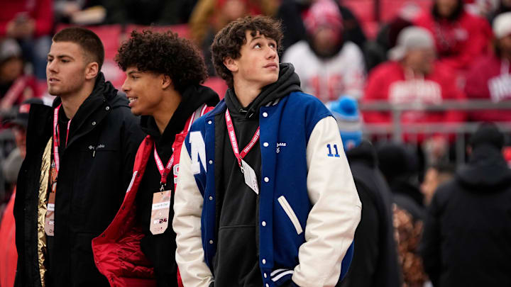 Nazareth High (Pa.) quarterback Peyton Falzone, right, watches warm-ups before an Ohio State Buckeyes game. Falzone has committed to  Penn State's 2026 recruiting class.
