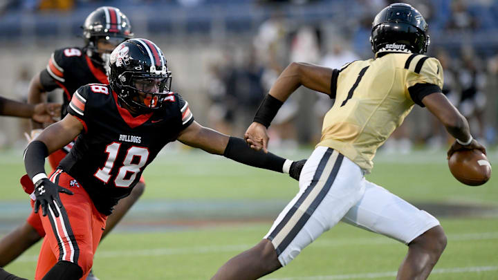 Warren G. Harding quarterback Chaz Coleman eludes the pass rush during a 2024 game vs. McKinley High in Ohio. Warren G. Harding quarterback Chaz Coleman eludes the pass rush during a 2024 game vs. McKinley High in Ohio.