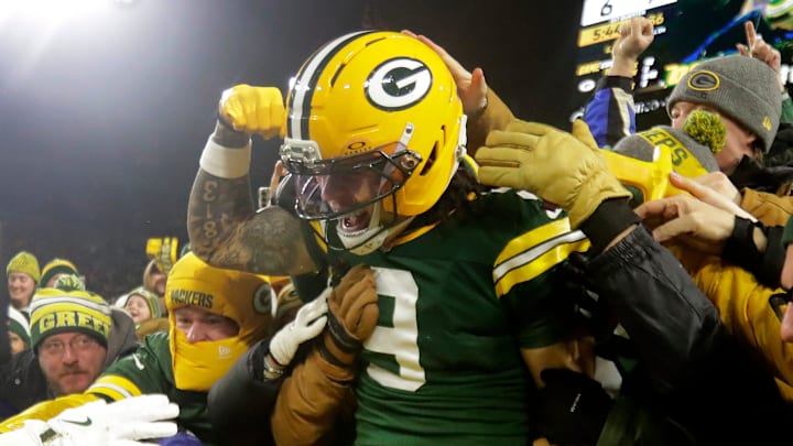 Green Bay Packers receiver Christian Watson celebrates after scoring a touchdown last season.