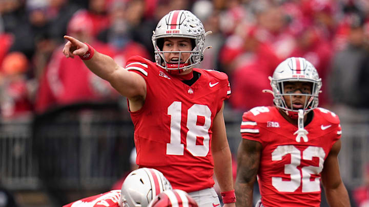 Ohio State quarterback Will Howard motions at the line of scrimmage during a game. The Buckeyes host archrival Michigan this weekend.