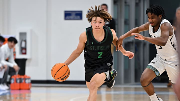 St. Joseph sophomore guard Malcolm Price dribbles down court during a 76-67 win over Salesian in the premier game of the Crush in the Valley Showcase. Price's Knights play Buchanan in Saturday's Central Section Division 1 title game. 