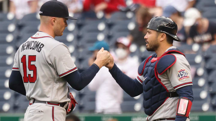 Former Atlanta Braves relief pitcher Sean Newcomb (15) celebrates with Braves catcher Alex Jackson (12) after their game against the Washington Nationals at Nationals Park.