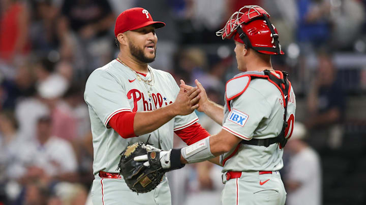 Aug 21, 2024; Atlanta, Georgia, USA; Philadelphia Phillies relief pitcher Carlos Estevez (53) celebrates with catcher J.T. Realmuto (10) after a victory over the Atlanta Braves at Truist Park