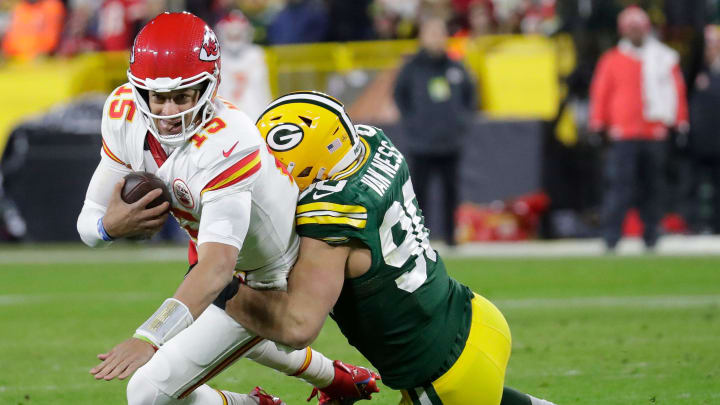 Green Bay Packers defender Lukas Van Ness (90) sacks Kansas City Chiefs quarterback Patrick Mahomes (15) during their game on Dec. 3 at Lambeau Field.