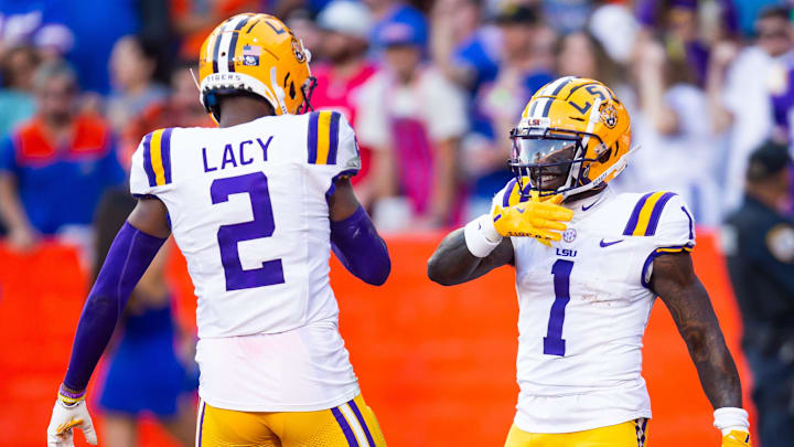 LSU Tigers wide receiver Kyren Lacy (2) celebrates teammates LSU Tigers wide receiver Aaron Anderson (1) touchdown during the first half at Ben Hill Griffin Stadium in Gainesville, FL on Saturday, November 16, 2024. [Doug Engle/Gainesville Sun]
