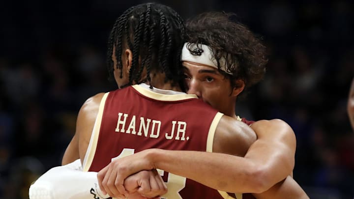 Mar 8, 2025; Pittsburgh, Pennsylvania, USA;  Boston College Eagles guard Dion Brown (1) and guard Dion Brown (right) embrace as time runs out against the Pittsburgh Panthers at the Petersen Events Center. Mandatory Credit: Charles LeClaire-Imagn Images