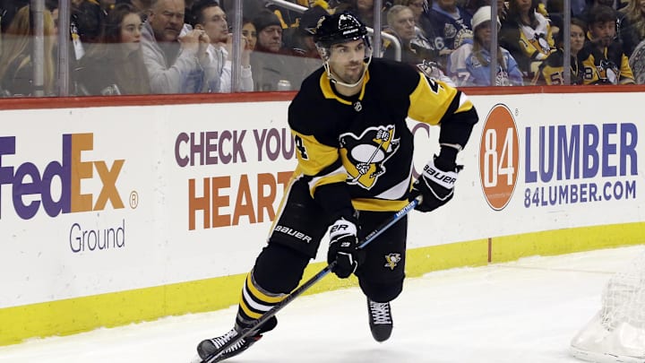 Feb 14, 2020; Pittsburgh, Pennsylvania, USA;  Pittsburgh Penguins defenseman Justin Schultz (4) moves the puck against the Montreal Canadiens during the third period at PPG PAINTS Arena. The Penguins won 4-1. Mandatory Credit: Charles LeClaire-Imagn Images