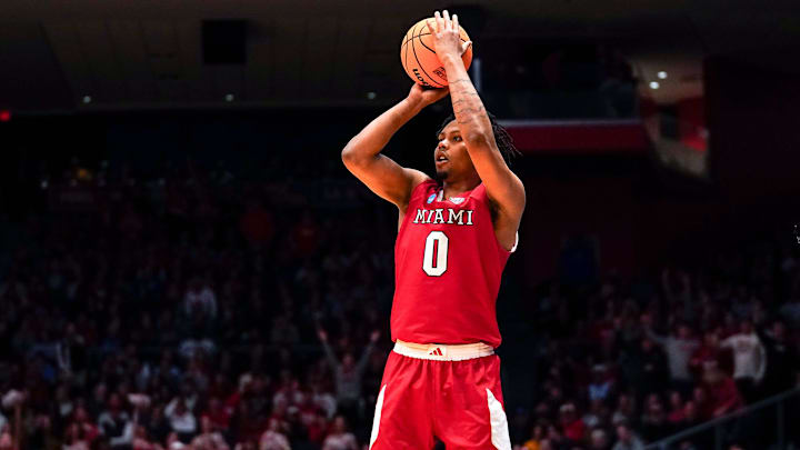 Miami (OH) RedHawks wing Eian Elmer (0) jumps to shoot from three point range in the first half of the NCAA Tournament First Four game between the Miami Redhawks and Southern Methodist University Mustangs, Wednesday, March 18, 2026, at University of Dayton Arena in Dayton, Oh.