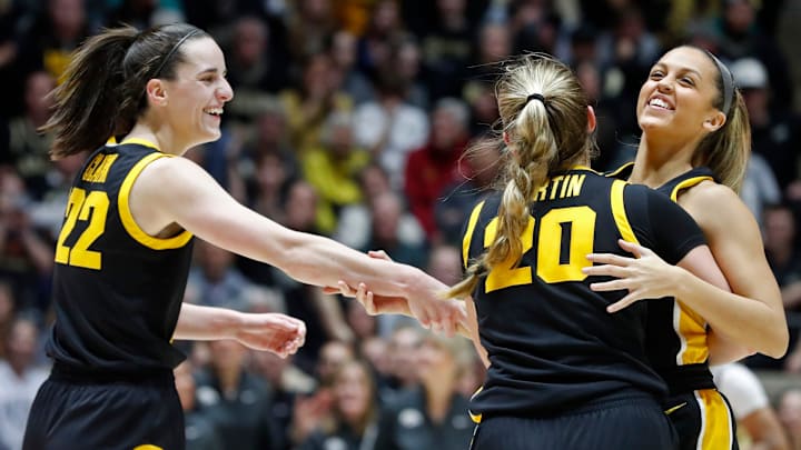 Iowa Hawkeyes guard Caitlin Clark (22), Iowa Hawkeyes guard Kate Martin (20) and Iowa Hawkeyes guard Gabbie Marshall (24) celebrate during the NCAA women   s basketball game against the Purdue Boilermakers, Wednesday, Jan. 10, 2024, at Mackey Arena in West Lafayette, Ind.