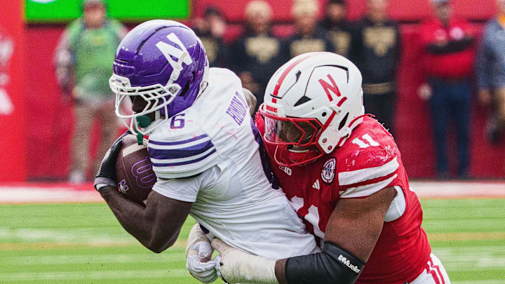 Oct 25, 2025; Lincoln, Nebraska, USA; Northwestern Wildcats running back Joseph Himon II (6) runs with the ball against Nebraska Cornhuskers defensive lineman Cameron Lenhardt (11) during the fourth quarter at Memorial Stadium. Mandatory Credit: Dylan Widger-Imagn Images Oct 25, 2025; Lincoln, Nebraska, USA; Northwestern Wildcats running back Joseph Himon II (6) runs with the ball against Nebraska Cornhuskers defensive lineman Cameron Lenhardt (11) during the fourth quarter at Memorial Stadium. Mandatory Credit: Dylan Widger-Imagn Images