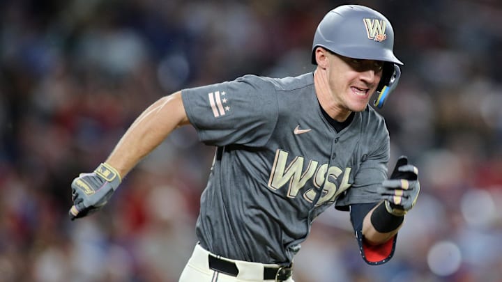 Aug 30, 2024; Washington, District of Columbia, USA; Washington Nationals outfielder Jacob Young (30) singles during the ninth inning against the Chicago Cubs at Nationals Park