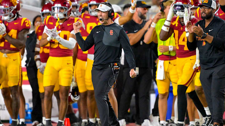 Oct 11, 2025; Los Angeles, California, USA;  USC Trojans head coach Lincoln Riley celebrates after kicker Ryon Sayeri (48) hit a 54-yard field goal in the second half against the Michigan Wolverines at United Airlines Field at the Los Angeles Memorial Coliseum. Mandatory Credit: Jayne Kamin-Oncea-Imagn Images