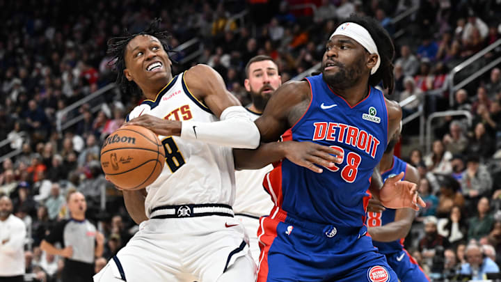 Feb 3, 2026; Detroit, Michigan, USA;  Denver Nuggets guard Peyton Watson (8) drives to the basket against Detroit Pistons forward Isaiah Stewart (28) in the third quarter at Little Caesars Arena. Mandatory Credit: Lon Horwedel-Imagn Images