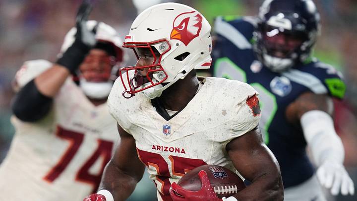 Arizona Cardinals running back Trey Benson (33) breaks out of the backfield against the Seattle Seahawks at State Farm Stadium in Glendale, on Sept. 25, 2025. Arizona Cardinals running back Trey Benson (33) breaks out of the backfield against the Seattle Seahawks at State Farm Stadium in Glendale, on Sept. 25, 2025.
