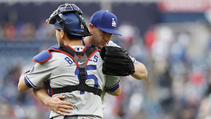 Los Angeles Dodgers relief pitcher Evan Phillips (59) celebrates with Dodgers catcher Austin Barnes (15) after the final out against the Washington Nationals at Nationals Park. Los Angeles Dodgers relief pitcher Evan Phillips (59) celebrates with Dodgers catcher Austin Barnes (15) after the final out against the Washington Nationals at Nationals Park.