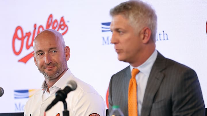 Nov 4, 2025; Baltimore, MD, USA; Left: Craig Albernaz looks at Right: President of Baseball Operations Mike Elias after being introduced as the Baltimore Orioles new Manager at Warehouse Bar. Mandatory Credit: Daniel Kucin Jr.-Imagn Images Nov 4, 2025; Baltimore, MD, USA; Left: Craig Albernaz looks at Right: President of Baseball Operations Mike Elias after being introduced as the Baltimore Orioles new Manager at Warehouse Bar. Mandatory Credit: Daniel Kucin Jr.-Imagn Images