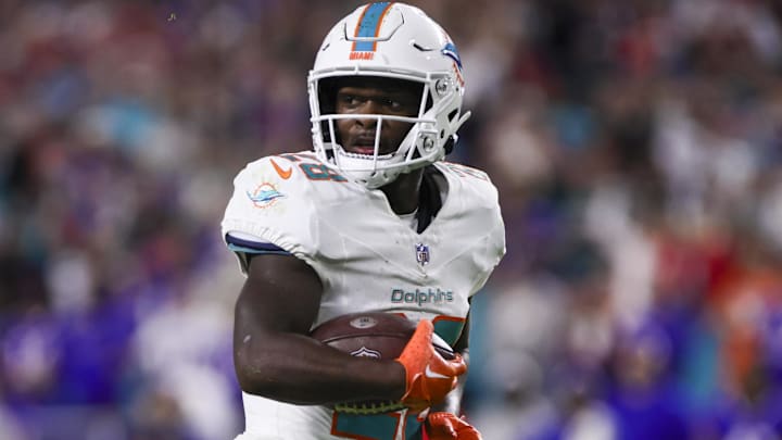 Jan 7, 2024; Miami Gardens, Florida, USA; Miami Dolphins running back De'Von Achane (28) runs with the football for a touchdown against the Buffalo Bills during the second quarter at Hard Rock Stadium. Mandatory Credit: Sam Navarro-Imagn Images