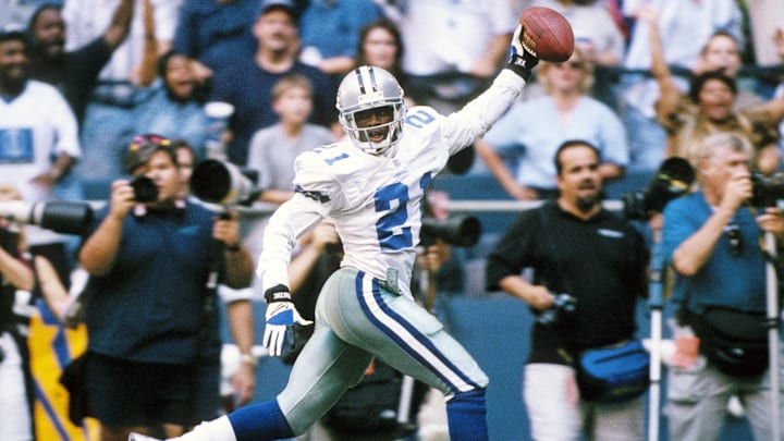 Sep 11, 1997; Irving, TX, USA; FILE PHOTO: Dallas Cowboys  defensive back  Deion Sanders (21) celebrating as he scores a touchdown on an interception against the  Chicago Bears at Texas Stadium. Mandatory Credit: James D. Smith-Imagn Images