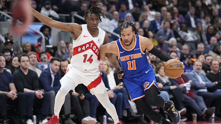 Feb 4, 2025; Toronto, Ontario, CAN; New York Knicks guard Jalen Brunson (11) drives to the net against Toronto Raptors guard Ja'Kobe Walter (14) during the first half at Scotiabank Arena. Mandatory Credit: John E. Sokolowski-Imagn Images