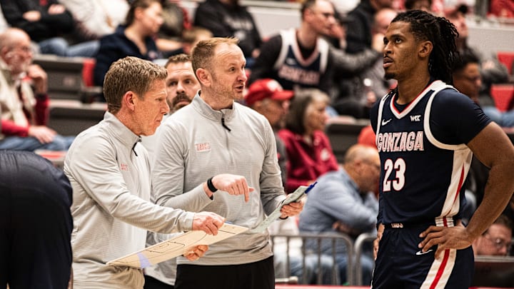 Gonzaga Bulldogs head coach Mark Few (left), assistant coach Stephen Gentry (middle) and guard Adam Miller (right).