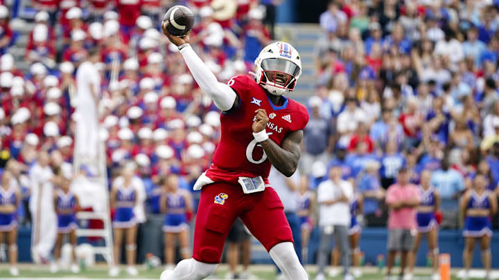 Sep 23, 2023; Lawrence, Kansas, USA; Kansas Jayhawks quarterback Jalon Daniels (6) throws a pass during the first half against the Brigham Young Cougars at David Booth Kansas Memorial Stadium. Mandatory Credit: Jay Biggerstaff-Imagn Images
