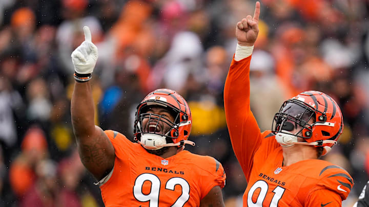 Cincinnati Bengals defensive end Trey Hendrickson (91) celebrates a sack with defensive tackle BJ Hill (92) in the first quarter of the NFL Week 12 game between the Cincinnati Bengals and the Pittsburgh Steelers at Paycor Stadium in Cincinnati on Sunday, Nov. 26, 2023.