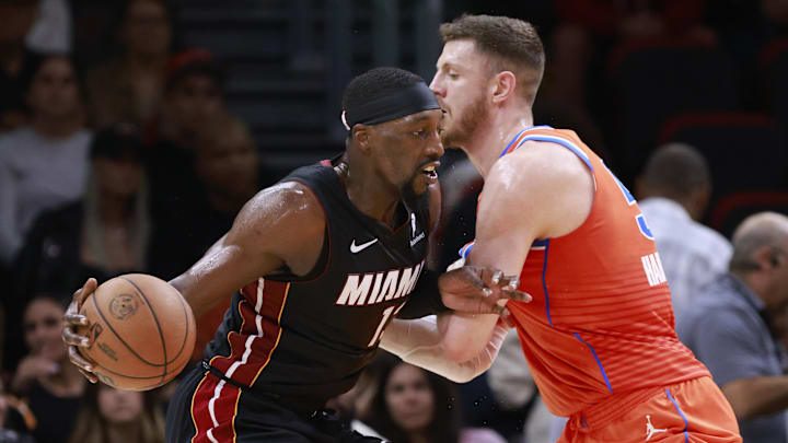Dec 20, 2024; Miami, Florida, USA; Oklahoma City Thunder center Isaiah Hartenstein (55) defends Miami Heat center Bam Adebayo (13) during the first half at Kaseya Center. Mandatory Credit: Rhona Wise-Imagn Images Dec 20, 2024; Miami, Florida, USA; Oklahoma City Thunder center Isaiah Hartenstein (55) defends Miami Heat center Bam Adebayo (13) during the first half at Kaseya Center. Mandatory Credit: Rhona Wise-Imagn Images