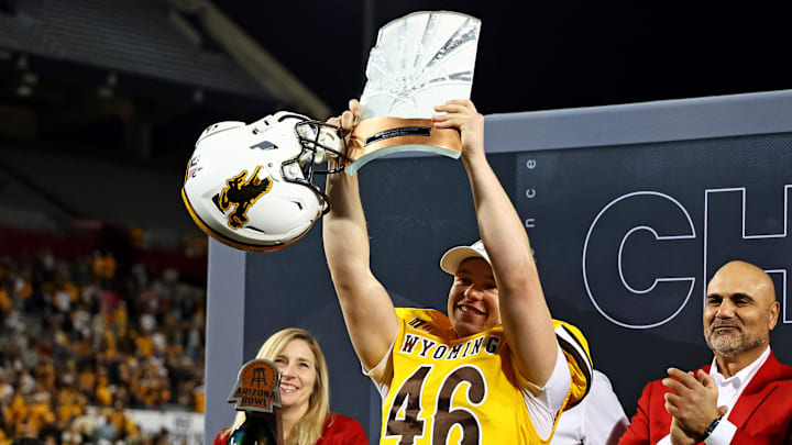 Wyoming Cowboys place kicker John Hoyland celebrates after beating the Toledo Rockets in the Arizona Bowl.