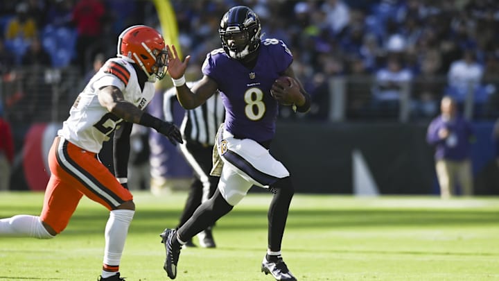 Nov 12, 2023; Baltimore, Maryland, USA;  Baltimore Ravens quarterback Lamar Jackson (8) rushes as Cleveland Browns cornerback Martin Emerson Jr. (23) defends during the first half at M&T Bank Stadium. Mandatory Credit: Tommy Gilligan-Imagn Images